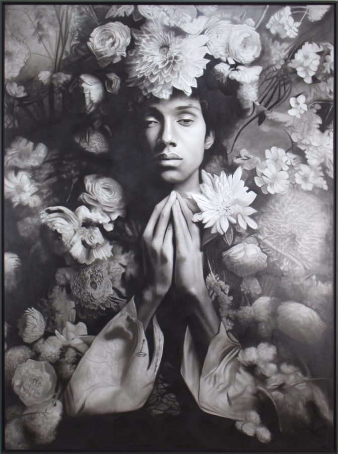 Jardim das fragilidades I by Ritchelly Oliveira: a young man with his hands pressed together in front of his chest, surrounded by dense flowers, in black and white